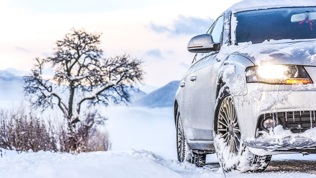 Winter Tire Myths: BUSTED (What You NEED to Know for 2025/2026) ice and snow covered car in winter setting