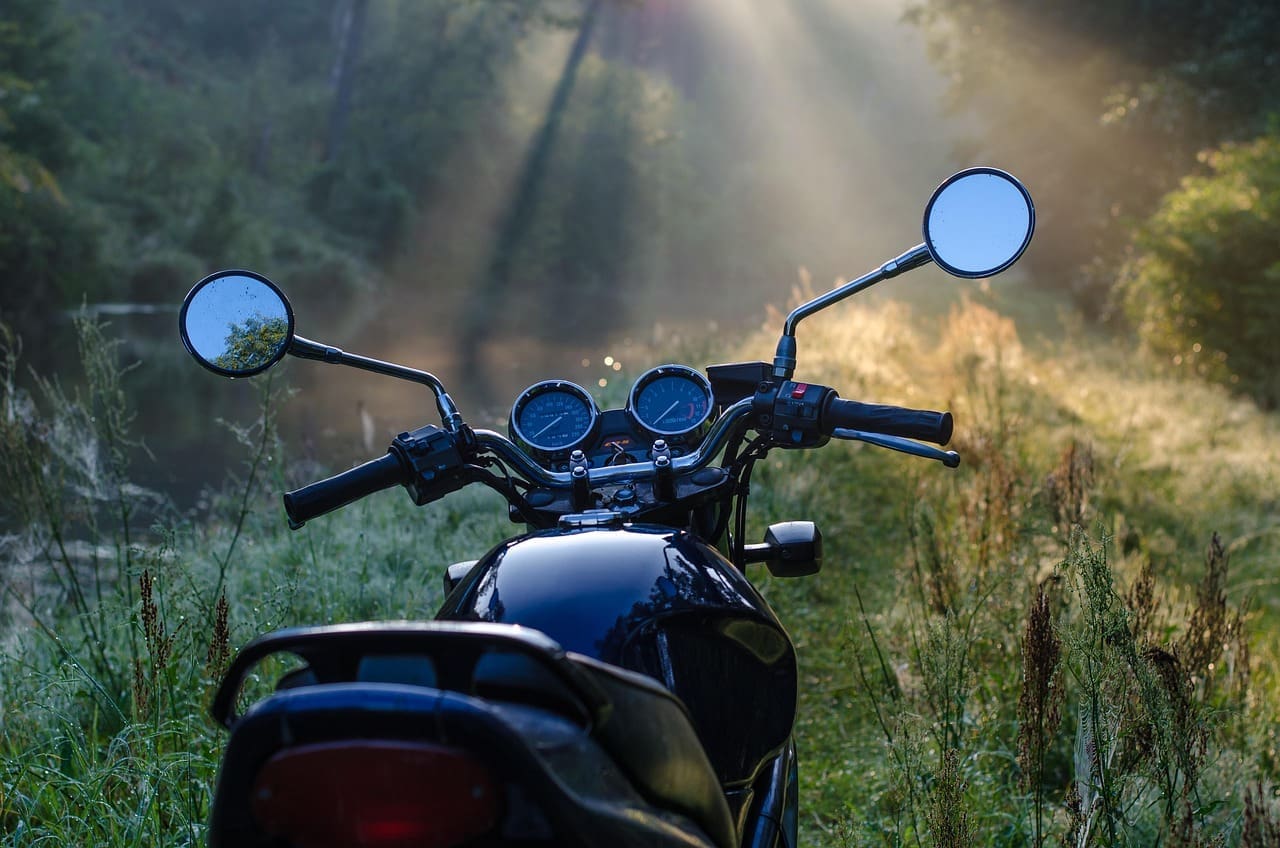 Start Your Vehicle Adventure: Everything You Need to Know motorcycle parked in a dewy forest
